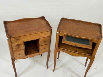 Two wooden bedside tables, one opening with...