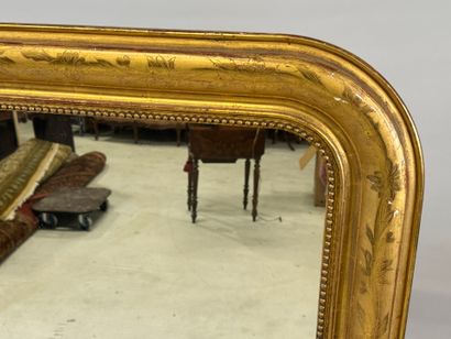 Wood and gilded stucco mirror decorated with...