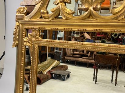Gilded wood mirror with foliate decoration,...