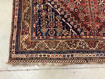 Oriental hand-knotted wool rug with stylized...
