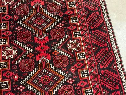 Hand-knotted wool rug with stylized motifs...