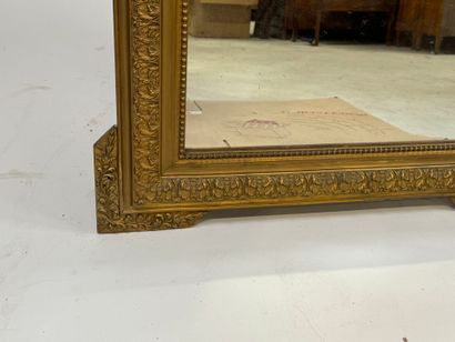 Wood and gilded stucco mirror decorated with...