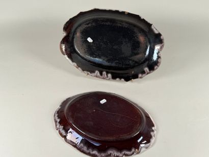 Two black butt plates, scalloped edge.
38...