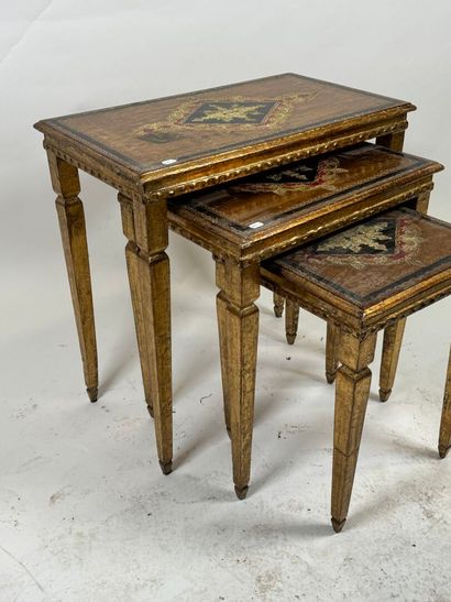 Series of three gilded wood nesting tables,...