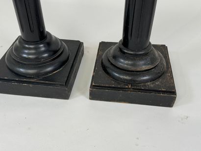 Two blackened wood saddles, fluted shaft,...