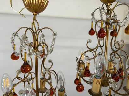 Pair of gilded metal chandeliers with colored...