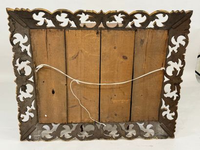 Mirror in gilded wood, with openwork and...