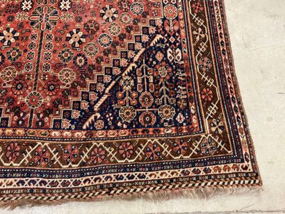 Oriental hand-knotted wool rug with stylized...