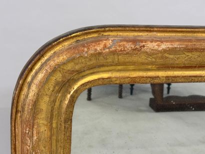 Wood and gilded stucco mirror, the upper...