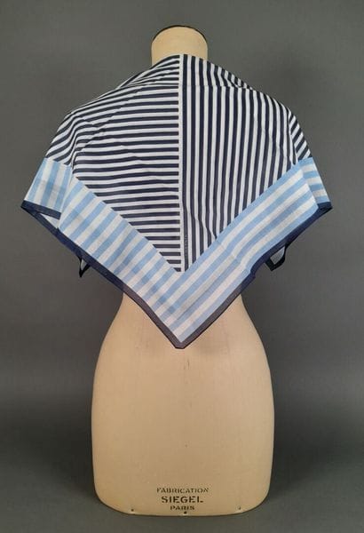 NINA RICCI.
Set of two cotton squares decorated...