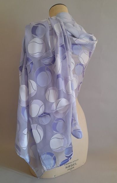 Lot including:
- COACH.
Fringed cotton square...