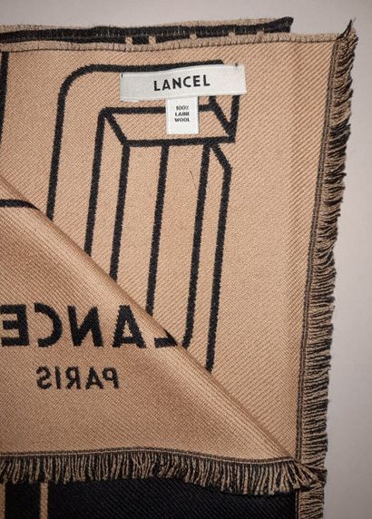 LANCEL, PARIS.
Fringed wool scarf decorated...