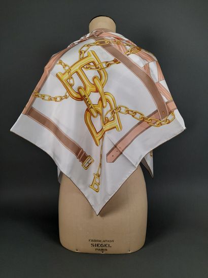 BALLY.
Silk twill square decorated with buckles,...