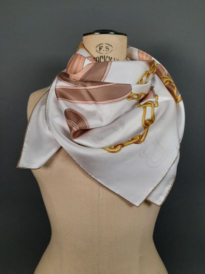 BALLY.
Silk twill square decorated with buckles,...