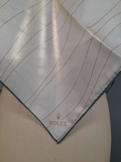 ROLEX.
Carré en twill de soie à décor de...