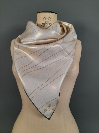 ROLEX.
Carré en twill de soie à décor de...