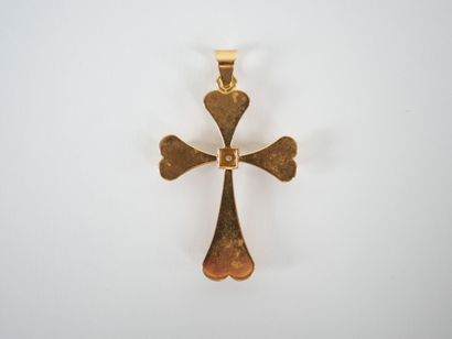 Stylized cross-pendant in 18K yellow gold...
