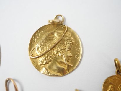 Set of five religious medals in 18K yellow...