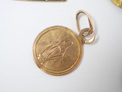 Set of five religious medals in 18K yellow...