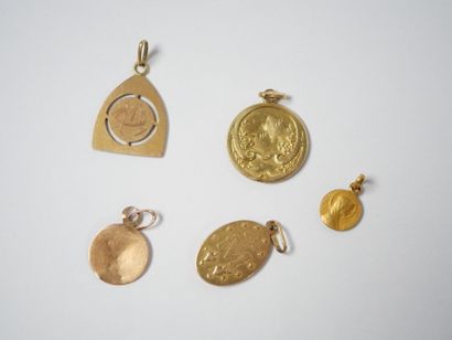 Set of five religious medals in 18K yellow...