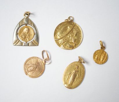 Set of five religious medals in 18K yellow...