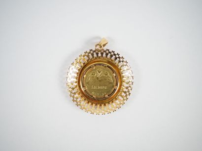 Circular pendant in 18K yellow gold centered...
