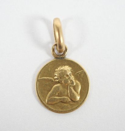 Small circular medal in 18K yellow gold with...