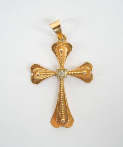 Stylized cross-pendant in 18K yellow gold...