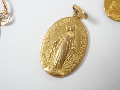 Set of five religious medals in 18K yellow...