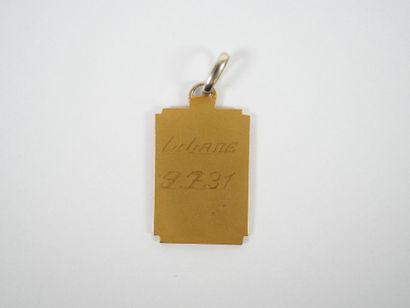 Rectangular religious medal in 18K yellow...