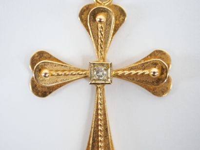 Stylized cross-pendant in 18K yellow gold...
