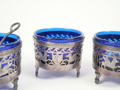 Set of four openwork silver salerons decorated...
