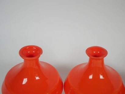 Orange-colored glass toiletry set including...