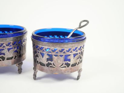 Set of four openwork silver salerons decorated...