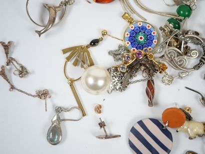 Lot of metal and silver costume jewelry including...