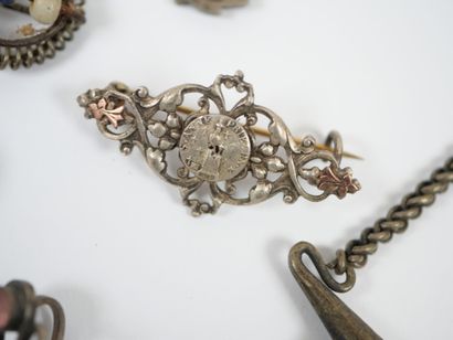 Lot of metal costume jewelry including mechanical...