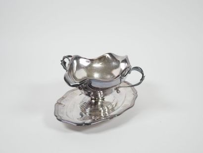 Sauce boat on its fixed silver display stand,...