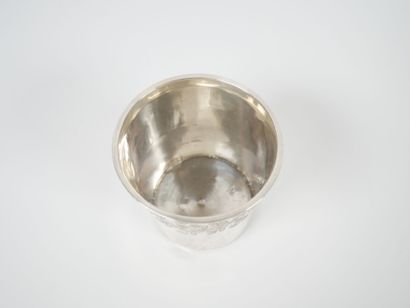 A Minerve-cut silver tumbler with chased...