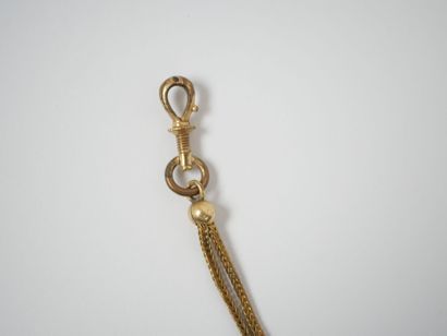 Gilt metal chatelaine adorned with a watch...