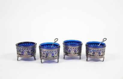 Set of four openwork silver salerons decorated...