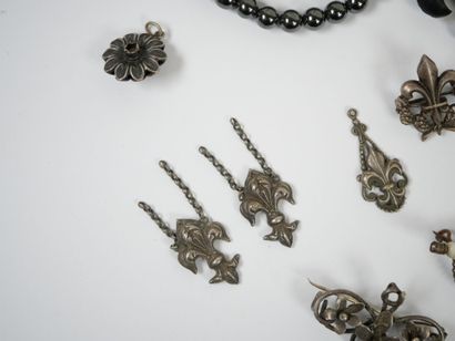 Lot of metal costume jewelry including mechanical...