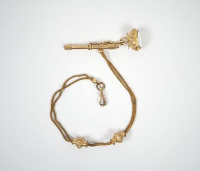 Gilt metal chatelaine adorned with a watch...