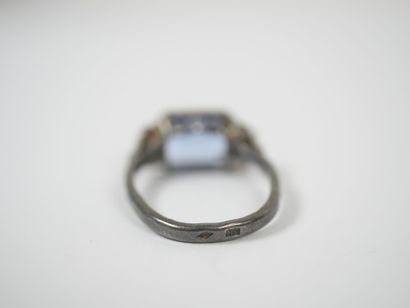 Silver ring set with a probable emerald-cut...