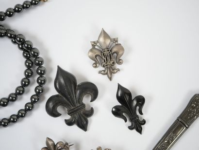 Lot of metal costume jewelry including mechanical...