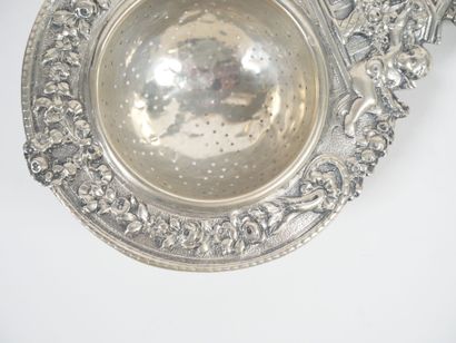 Foreign silver tea-pot decorated with cherubs...