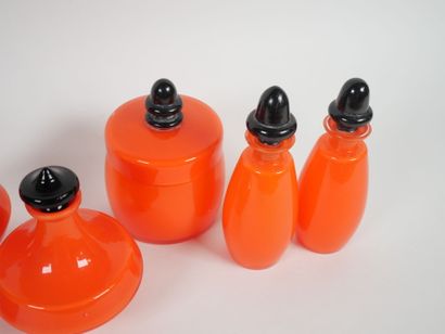 Orange-colored glass toiletry set including...