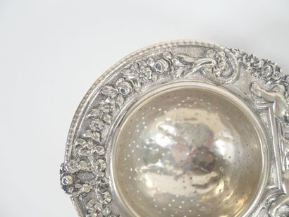 Foreign silver tea-pot decorated with cherubs...