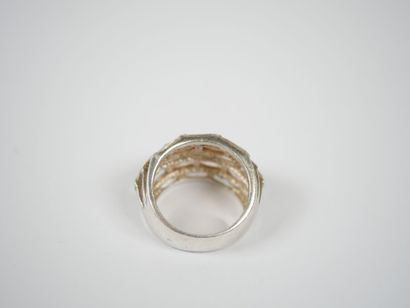 Two metal rings, one with five rows of white...