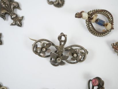 Lot of metal costume jewelry including mechanical...