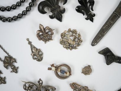 Lot of metal costume jewelry including mechanical...